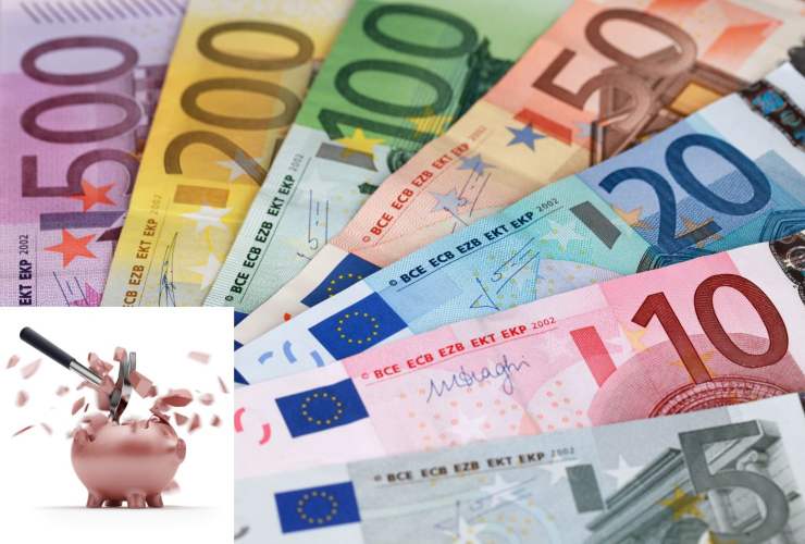 Banocnote in euro e martello che rompe un salvadanaio